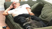 'Cat Grandpa' goes viral for napping with shelter pets